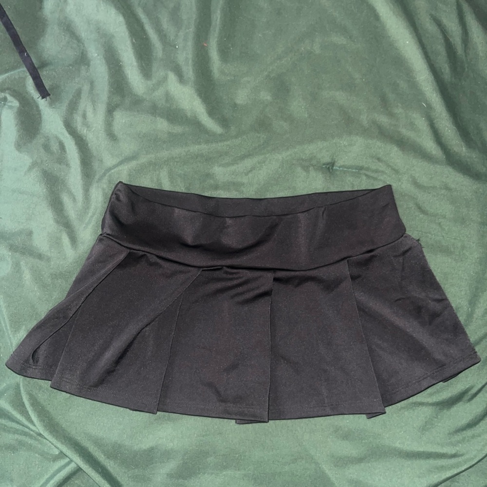 Never worn, small black skirt